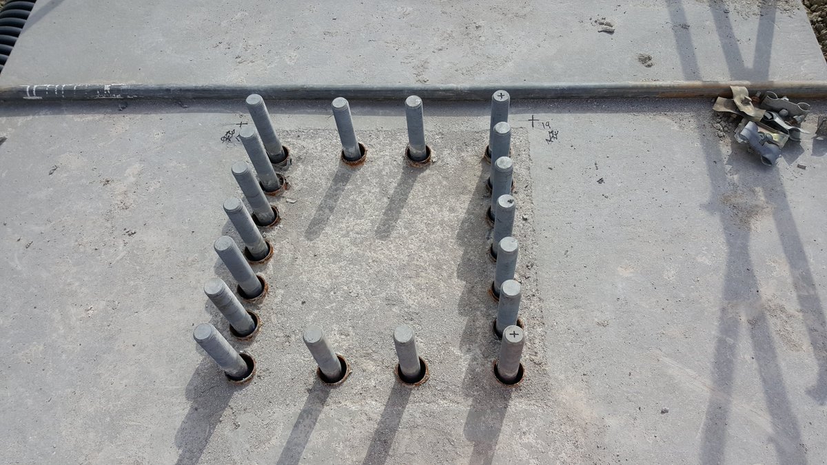 The holding-down bolts can be on large frames which clash with the pile starter bars (bits of steel sticking out of the piles) which is why plinths are used to lift bolts over the starter bars. New gantries have piles spaced further apart so bolts fit inbetween but looks bulkier
