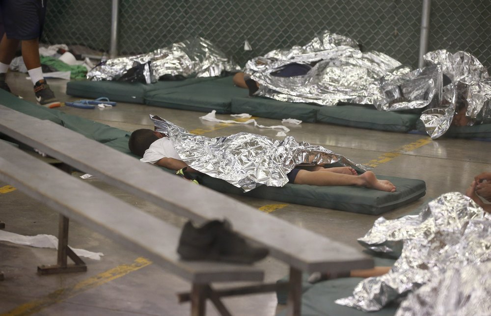 TrumpWarRoom's tweet photo. 2 days after these photos were taken in 2014, Joe Biden said he was "proud" of the conditions separated children were being kept in.

"If they’re good enough for our military," Biden said, "they’re good enough for these young people." https://t.co/ER5ZAawp0W