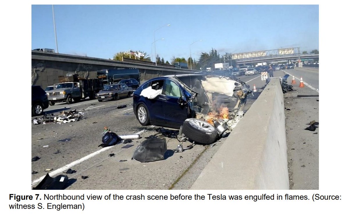 the crash ripped off the front half of the Tesla, which started to burn. nearby drivers stopped to pull the driver out.