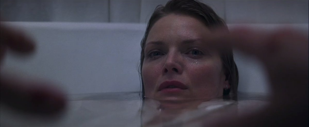 An excellent moment of true horror in What Lies Beneath as Norman RISES from the floor to reach for a paralyzed Claire, able only to squint her eyes enough to convey revulsion, before he collapses back down again next to the tub. Serial killer jump scare perfection.