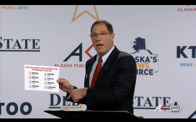 JMilesColeman's tweet photo. At debate, Al Gross brings out a sheet showing how many times Sullivan has tried to repeal the ACA #AKSen https://t.co/dvLgvHm2NK