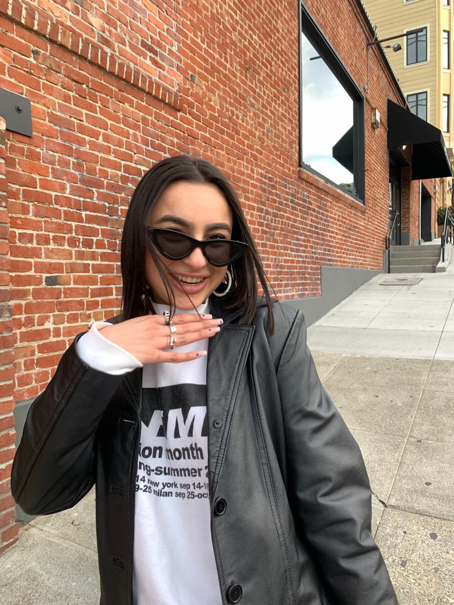 YGuilani's tweet photo. This is me in a photo :) If I see a brick wall there's a 100% chance I am taking a photo by it, these are my signature glasses, I am always laughing, and always in a blazer so again this is me in a photo lol  #mco335 https://t.co/p6mVRzTwp0