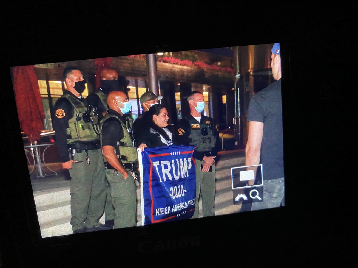 Here’s a photo of Los Angeles Sheriff’s Deputies posing with a Trump flag. Shot by photojournalist  @ChelseaLaurenLA.