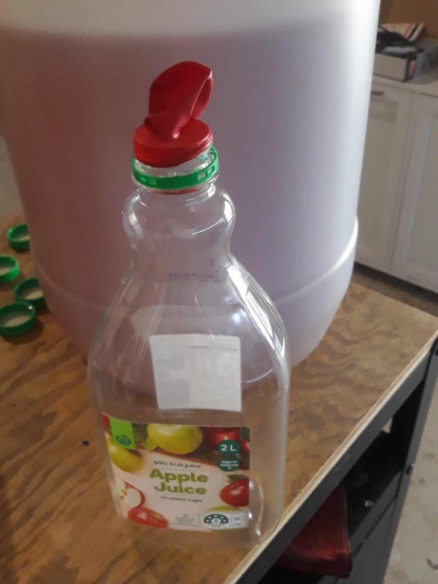 If your parents' allowance doesn't extend to brew flasks, buy some party ballons while you're grabbing the juice and bakers yeast. Tip some juice out to create headspace, tip in some yeast, and wack a balloon on top. Boom, redneck airlock right there.