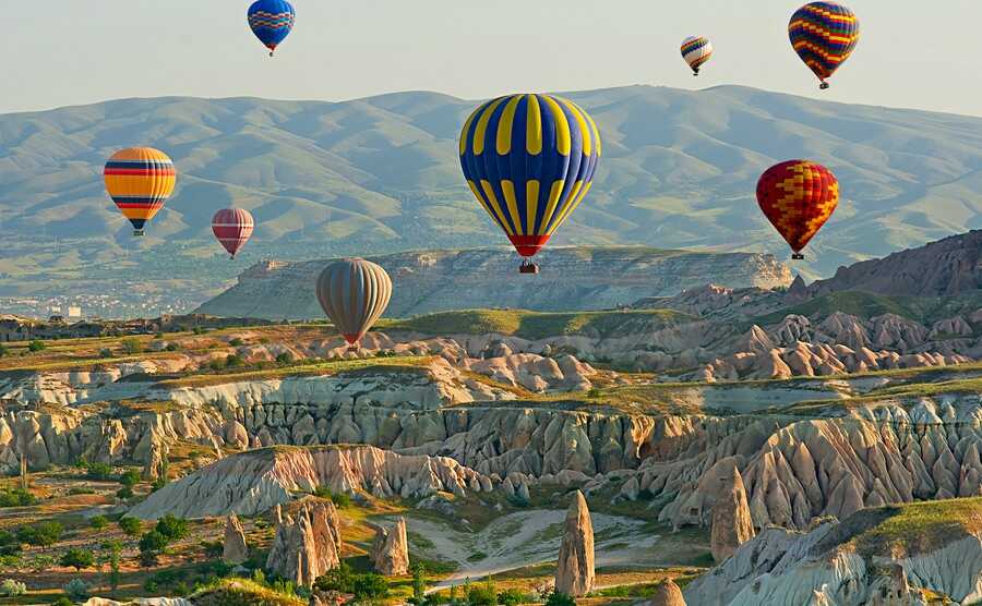 1. Cappadocia, TurkeyImagine waking up at sunrise, and seeing countless numbers of hot air balloons fly over your hotel.Enjoy a getaway at the luxurious cave suite, situated into a rocky landscape