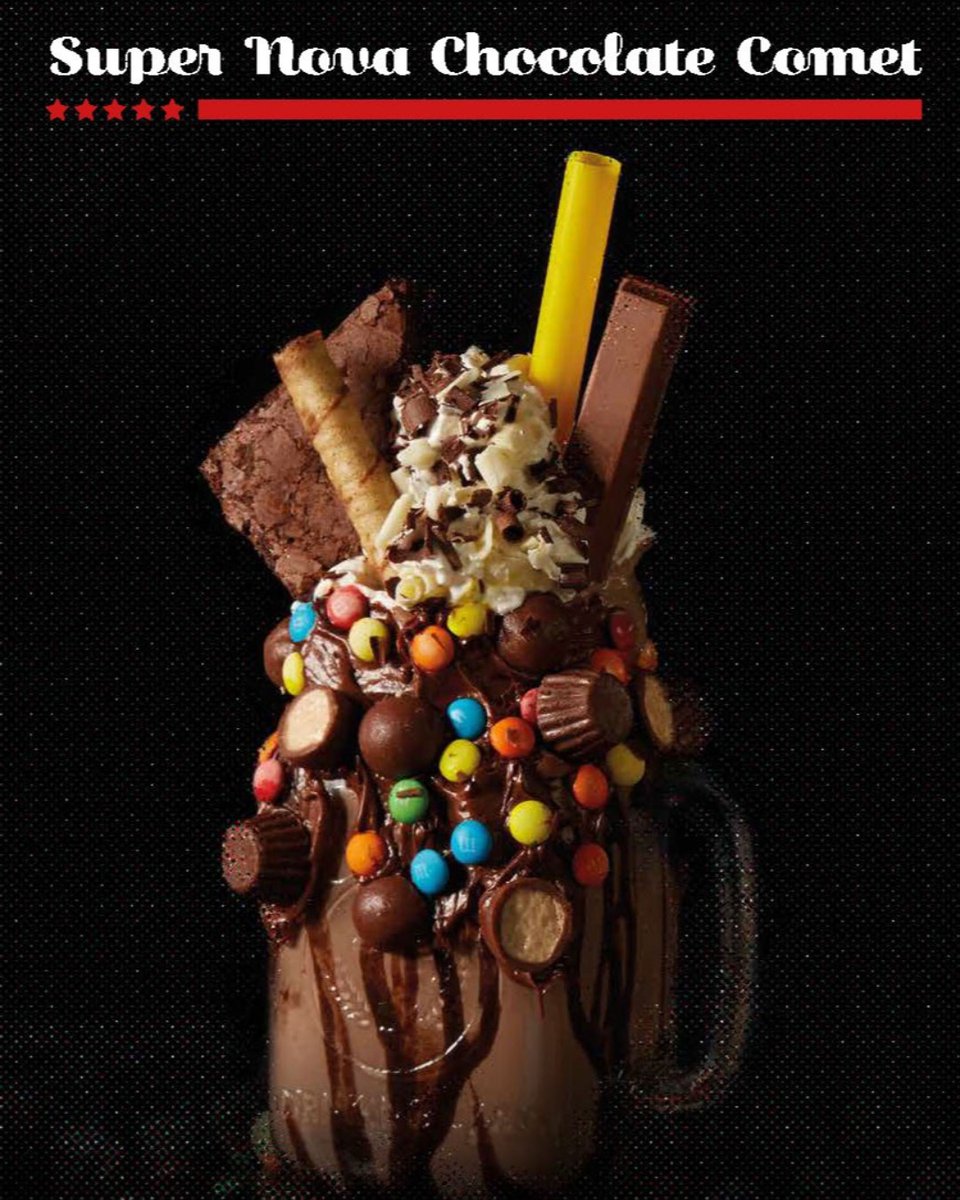 Try our Super Nova Chocolate Comet! A chocolate milkshake, whipped cream, topped with chocolate sauce, chocolate brownie, and Kit-Kat chocolate and candy! It's out of this world! #planethollywooddlp #disneyvillage #dessert #disneyeats #disneyvillage #milkshake