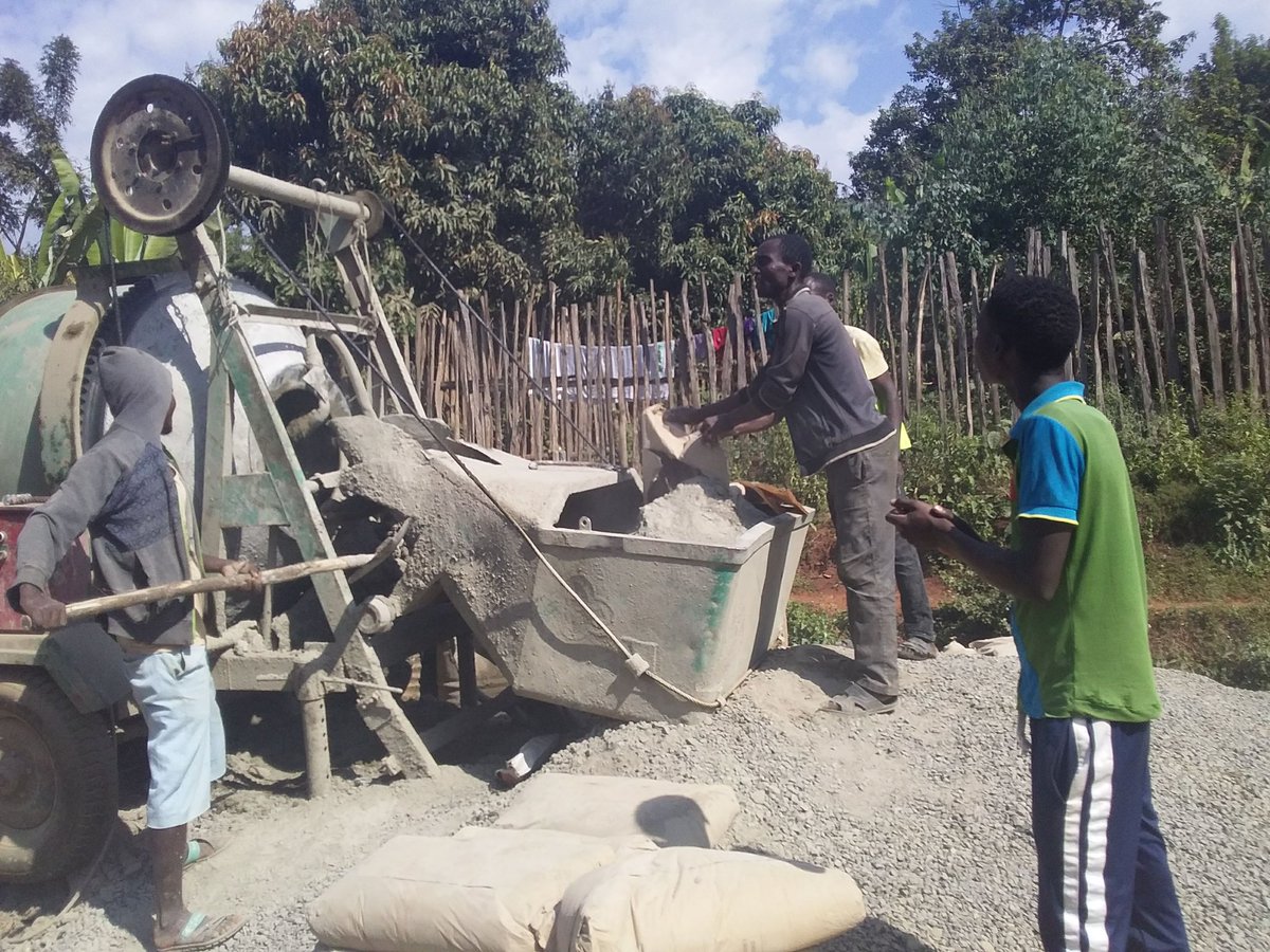 Young men working on road site construction at  #SNNPR, Ethopia. The machine you see is called Mixer.