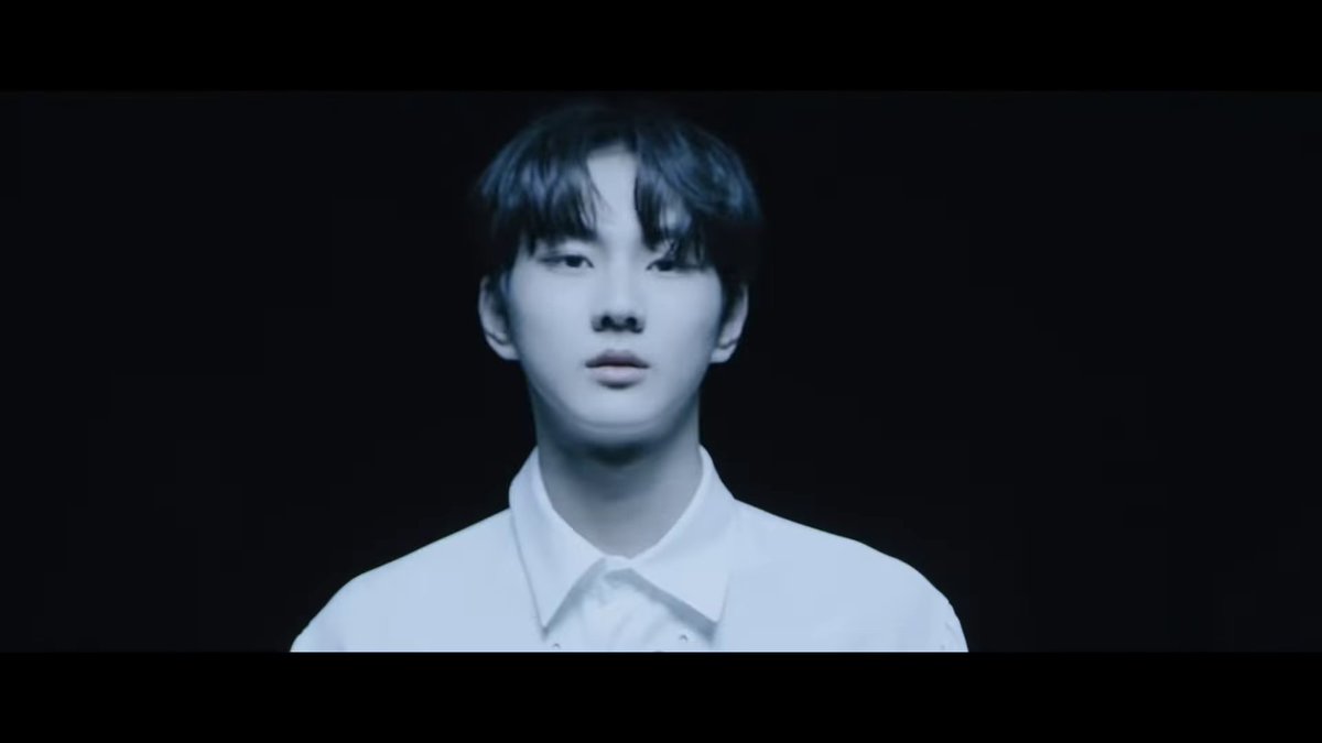 jungwon's face is then momentarily shown in the light, before it flickers & his face is dark again. we see a shot of jay looking worried (presumably for jungwon), & then when we see jungwon's face again, it's not scared ot worried or anything. he looks resolute.