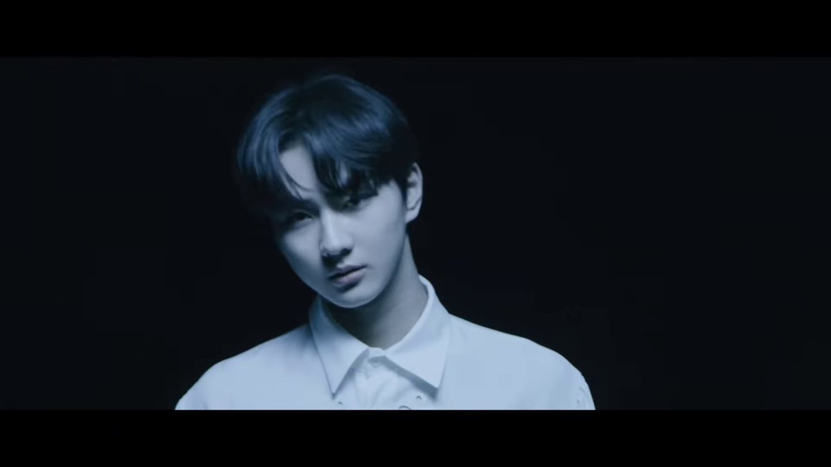 jungwon's face is then momentarily shown in the light, before it flickers & his face is dark again. we see a shot of jay looking worried (presumably for jungwon), & then when we see jungwon's face again, it's not scared ot worried or anything. he looks resolute.