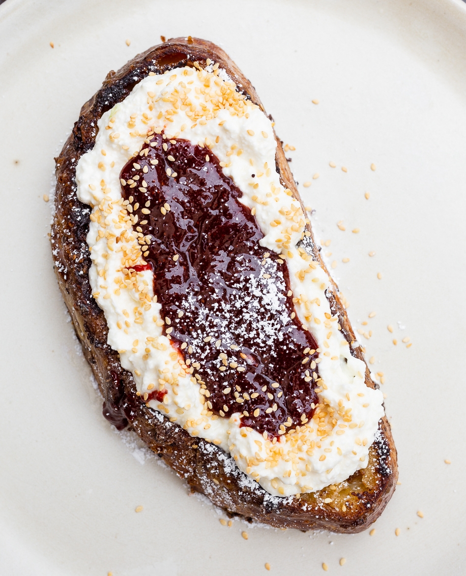 A fresh spin on French Toast! Ricotta French Toast with seasonal jam, benne seeds 🍓⁠

〰️〰️⁠
⁠
Outdoor patio dining is OPEN with proper social distancing protocols⁠