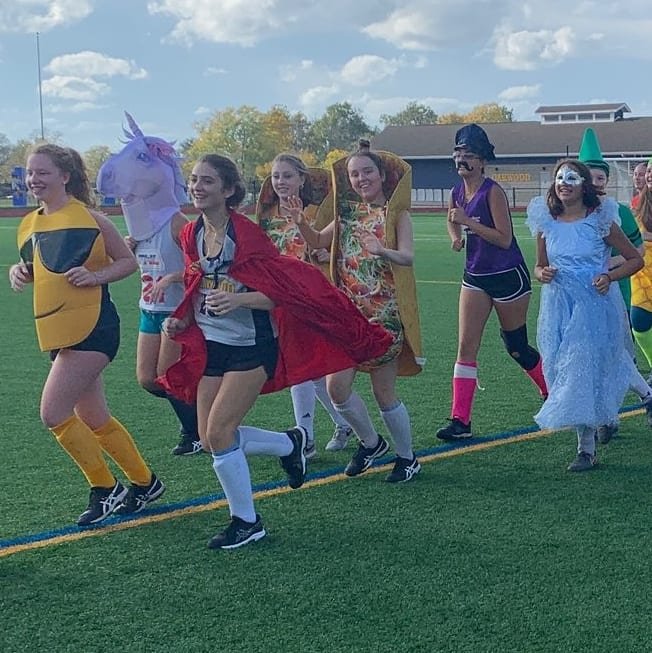 oakwoodfh2021's tweet photo. Our field hockey team has just begun its newest tradition. Commence, The Halloween Costume Practice featuring Jurassic Coach Miller, a few food groups, The Scooby Gang, and more... #halloweenhockey #costumepractice #rutrow #dino https://t.co/RNJW4UUVhS