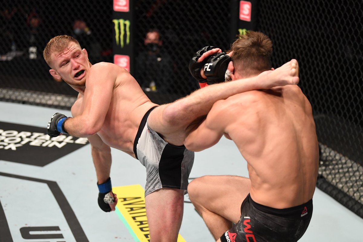 ufc's tweet photo. Who wants it more? 💢

Heading to round 3️⃣ on ESPN2.

[ #UFC254 | #InAbuDhabi | @VisitAbuDhabi ] https://t.co/cJHHfxTFay