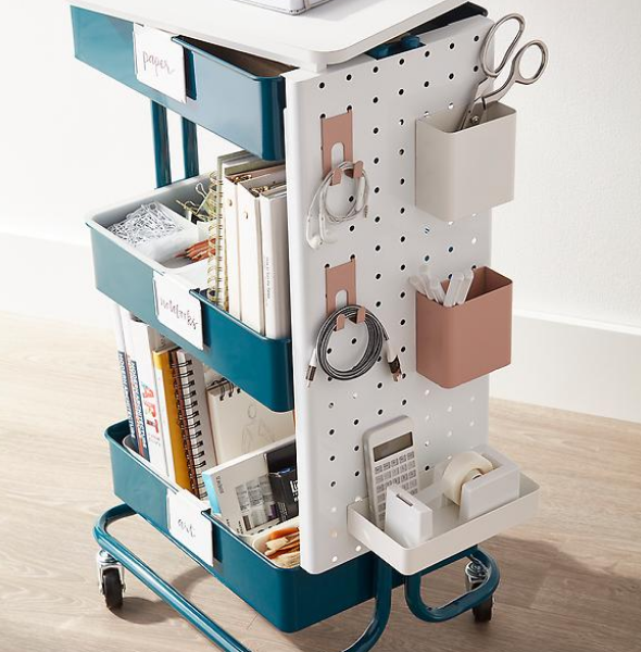 GEMINI: 3 tier rolling cart. comes with accessories you can mix and match, magnets stick to it, mobile so you can change your mind about where/what you need to use it for as much as you want  https://www.containerstore.com/s/home-office-storage-cart-starter-kit/d?q=3+tier+rolling+cart&productId=11013262