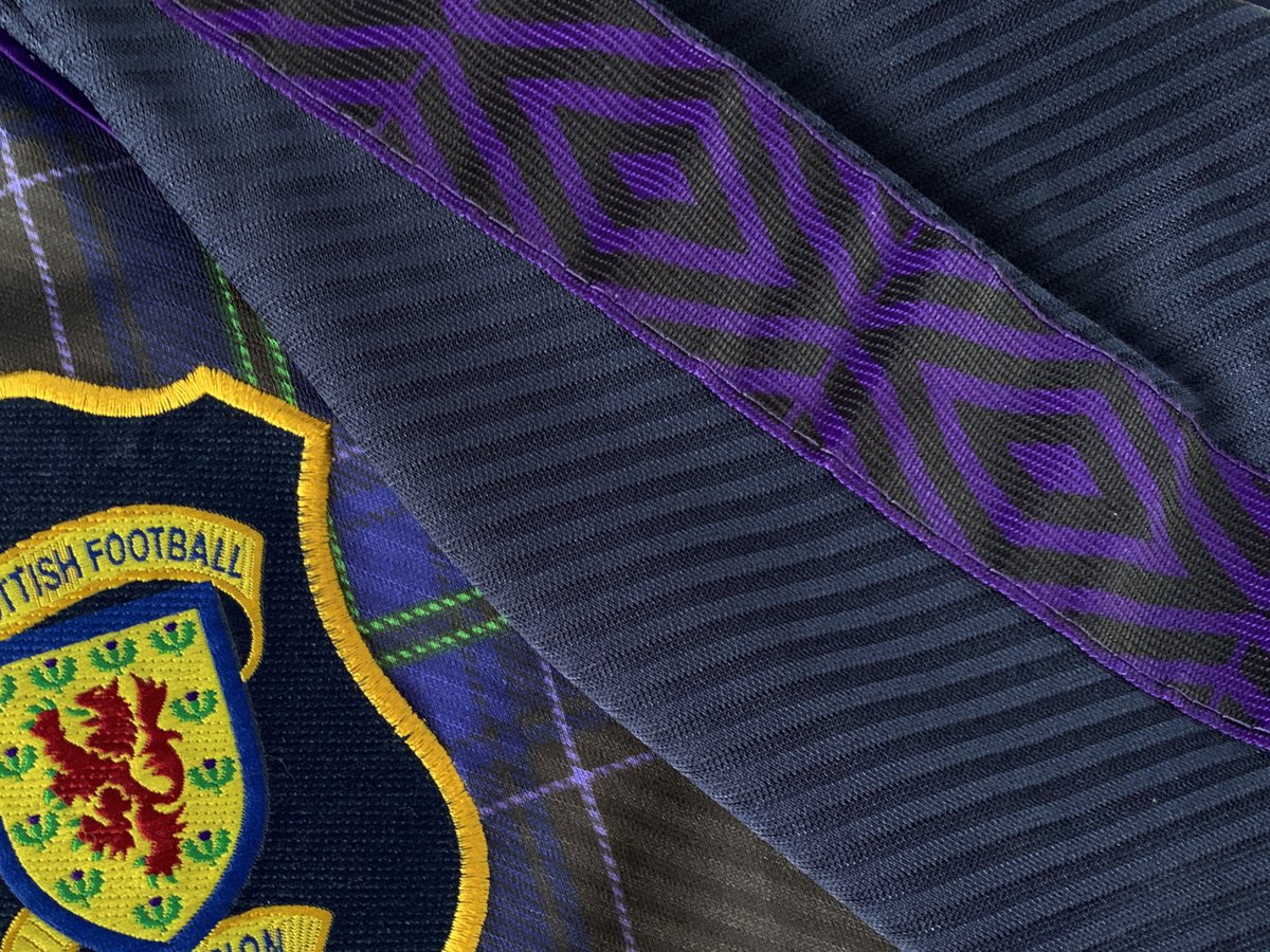 The retail versions of this shirt had a purple strip of fabric running down the length of the sleeves, with the Umbro double diamond pattern. This wasn’t allowed to be worn in tournaments because of UEFAs branding rules...