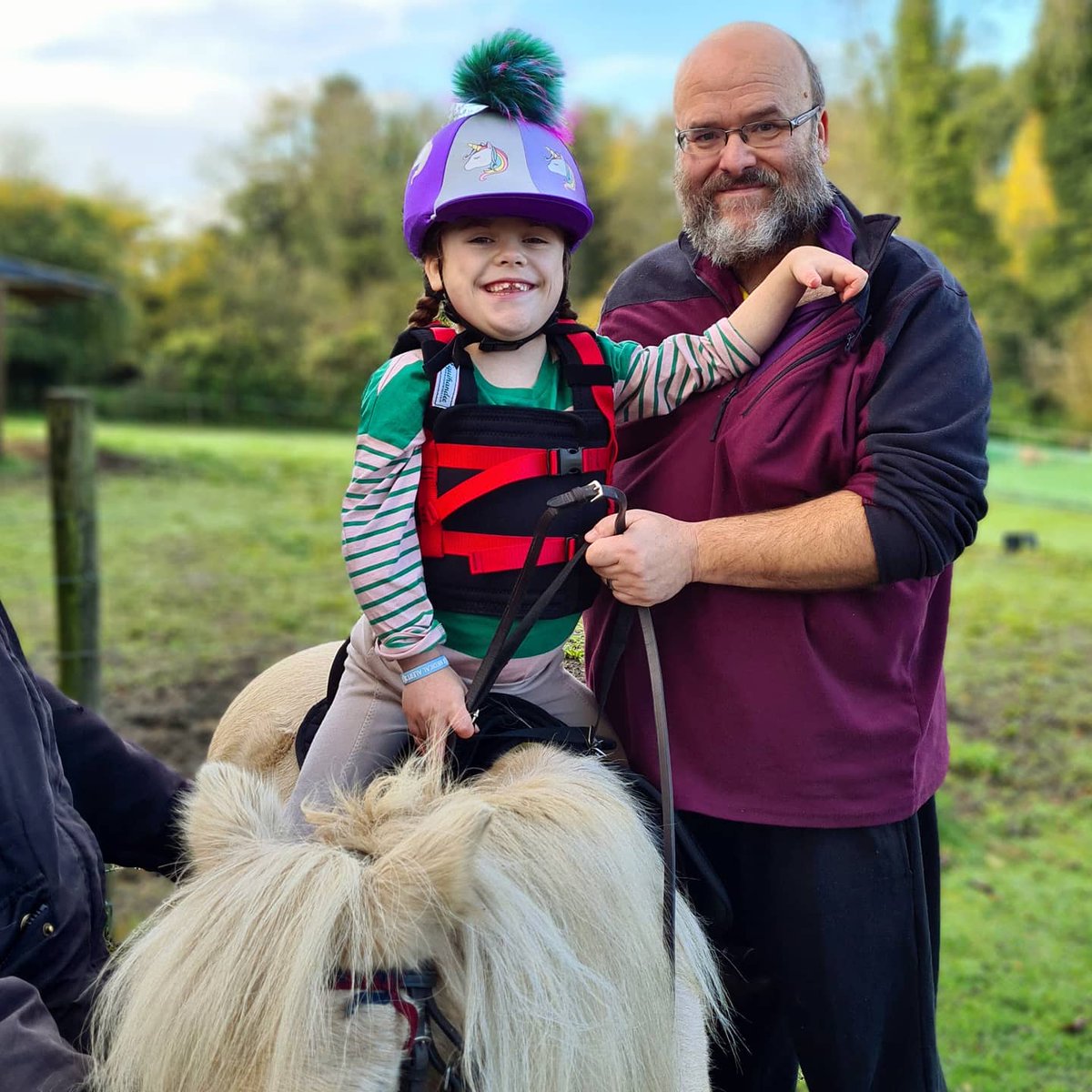 Cure4Carmela's tweet photo. Latest buy from @equihandee #EquihandeeFreedom #childharness gives us the extra safety to hold Carmela in the saddle when just one side walker is available.  #ridingsafetyharness #equinetherapy
Riding boots from @HelloTodhpurs
Riding hat from #Jollytotsequestrian
#horselover https://t.co/9hGOK52vYd