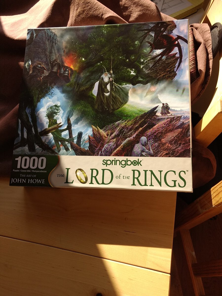 robinhobb's tweet photo. Sinking into melancholy, so treating myself to two of my favorite things. John Howe's art and a #SpringbokPuzzle. All made even better by LOTR theme. https://t.co/Zldg4wdoFE