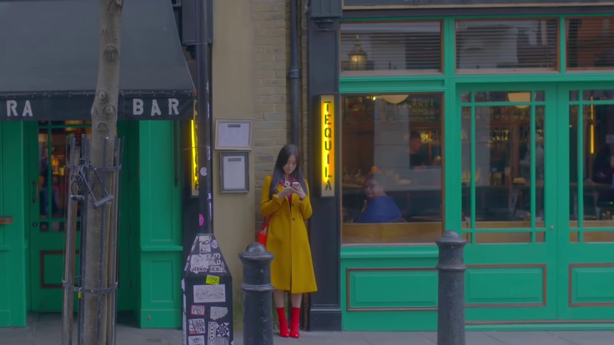 note how the whole video uses only primary colors and green to highlight things. heejin and hyunjin walk through town, like they are looking for haseul