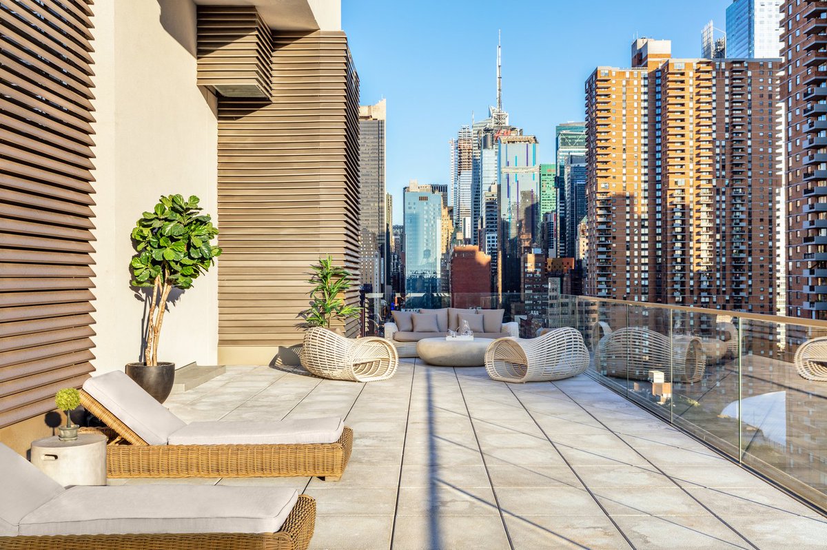 A large patio provides the residents of this apartment #building with a relaxing spot to take in the city views. #archi https://t.co/ZpO2ChWeku https://t.co/Eta5BnUywM