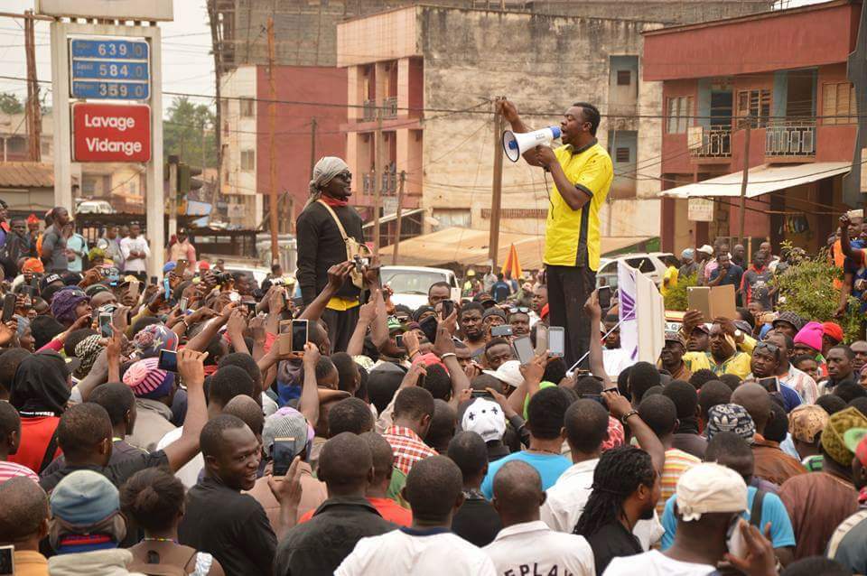 a popular teacher and journalist in Bamenda at the City Chemist Round About Mancho Bibixy planted himself in a white coffin to advocate for better governance in the two English speaking regions. This solitary act branded the crisis the name "the coffin revolution"