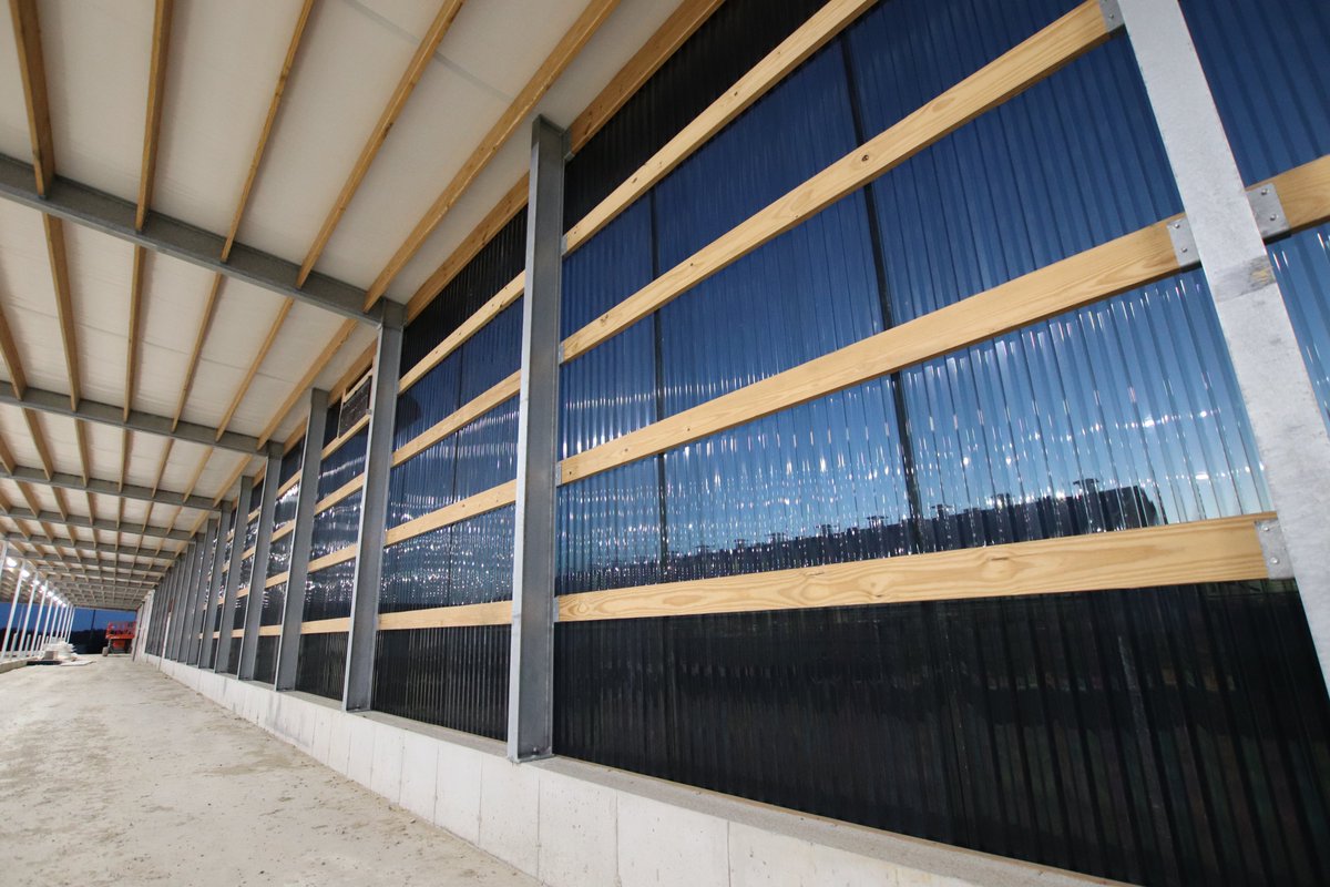 dairylanesystem's tweet photo. Tweet 2/2-Here's a progress update from the 5 x GEA R9500 robot project at A.H.E. Dairy Farm! The DLS tunnel and ridge fans and black polycarbonate side walls are now installed.

#DLSdairy #DLSrobotics #DLSstructure #dairyfarmers #dairyfarming #dairycows #dairy #agriculture #milk https://t.co/IfociF4JrM