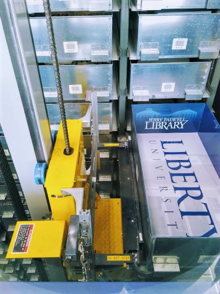 LibertyULibrary's tweet image. Have you met the library's robot? Our robot helps us keep 575,000 books safe, well-preserved, and easy to access! It only takes 10 minutes to get a book from the robot after requesting it! #LibraryResources #LibraryRobot #JFLibrary