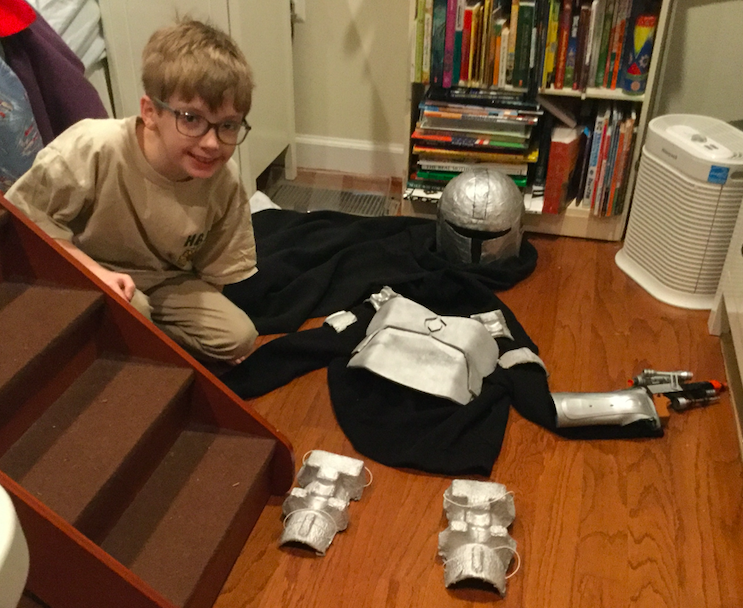 Mandalorian Maker! Our first entry is from 6th grader Isaac at H-B! "For the Shoulder and Leg Pieces we used old Wine bottle Containers that we found next to the Garbage." The arm piece is his dad's old arm brace. The helmet was paper mache'd! <a href="/APSLibrarians/">APS Library Services</a> <a href="/HBWProgram/">HBWoodlawn</a>