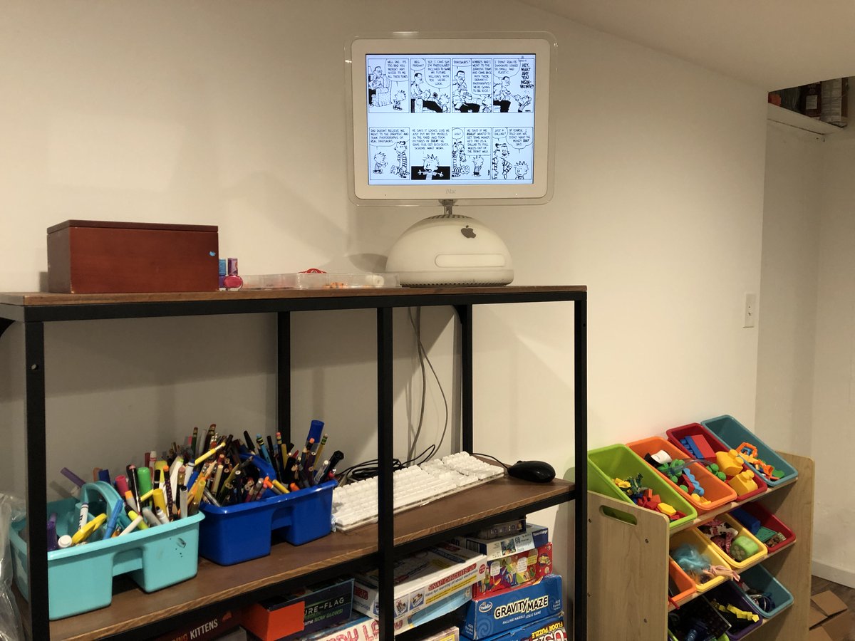 kenwalker's tweet image. . @jsnell @ismh Thought you would appreciate the iMac G4 in my kids’ playroom (otherwise known as my COVID WFH office) rotating Calvin and Hobbes. I used to have this on my desk at Audible and it always made for a great conversation piece. It also runs an NES emulator. ;)