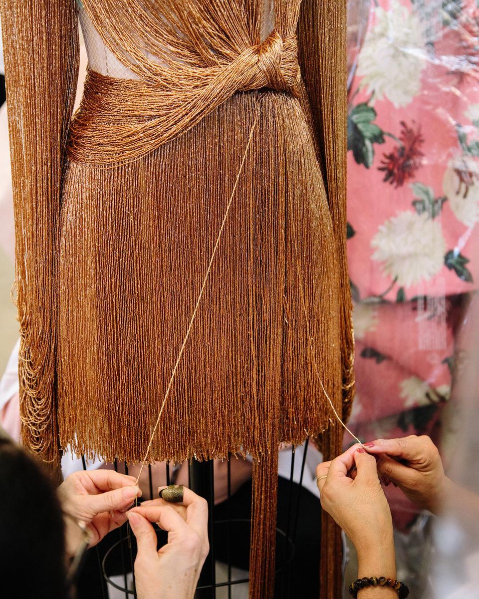 Good as gold ✨. Discover the making of #odlrfall2020's hand-beaded fringe dress.