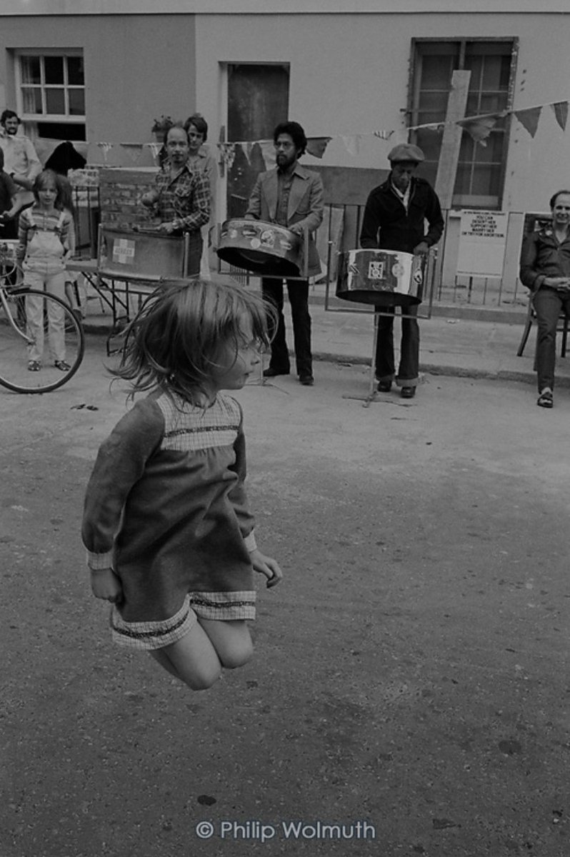 No one is born racist. .A kid dancing to the sound of the steel drums at the Carol Street Carnival, Camden Town, London, 1979.Photo  @philipwolmuth