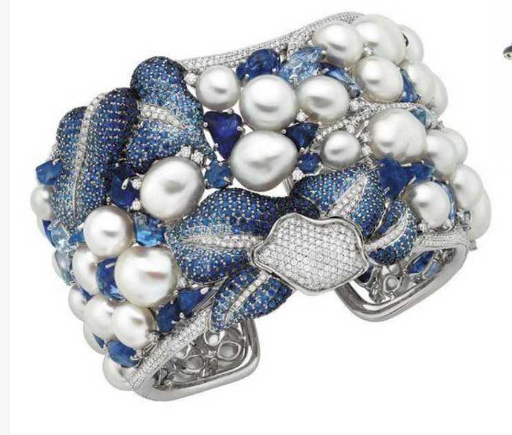 From Autore, pearls and sapphire gradients. Cuff bracelet. Let's all go kick senators.