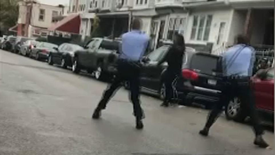 NBCPhiladelphia's tweet photo. A video captured a chaotic scene in West Philly as a man, who officials say was armed with a knife, approached police while his mother tried desperately to stop him moments before the officers opened fire and killed him. @[Matt DeLucia] has the details: https://t.co/AcJg4iO6iH https://t.co/0I6jYhKOua
