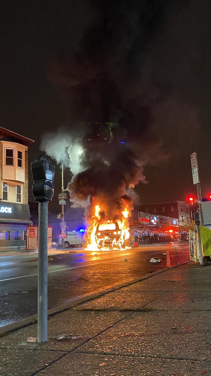 Still photo of burning Philadelphia Police vehicle. Credit: realjACAB