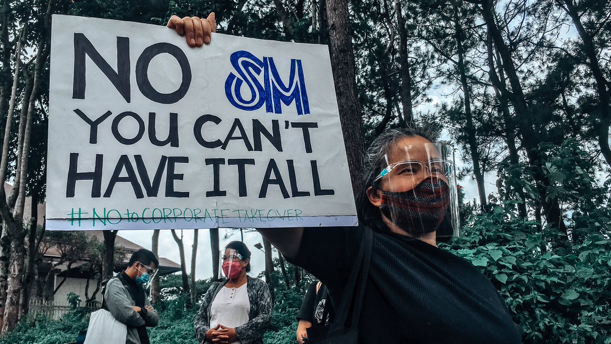  #NoToCorporateTakeover | In a quick response mobilization in Baguio City, a protester holds a “No, SM. You can’t have it all.” placard as an opposition to the corporate takeover of the mall giant for the “redevelopment” of the city’s public market.