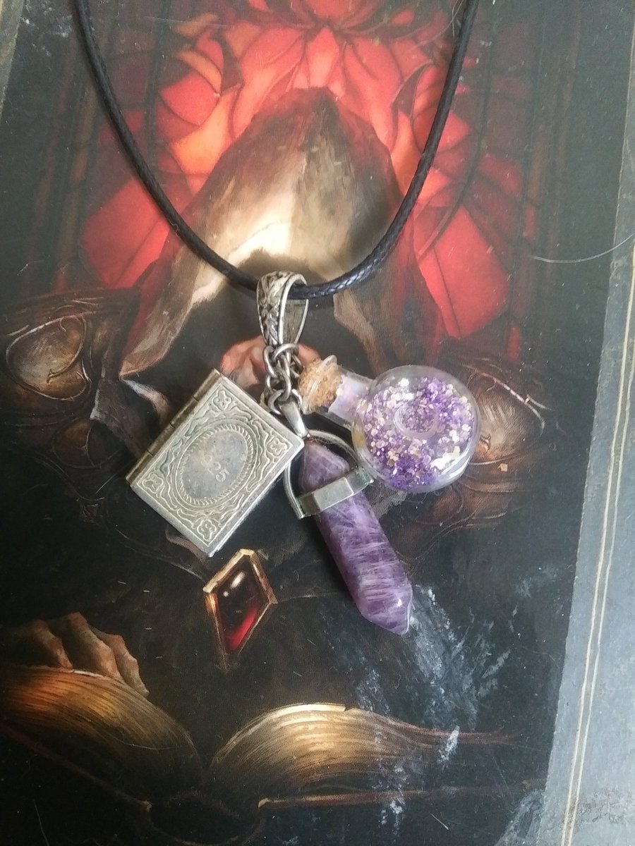 I was super excited to do this fanmade spotlight, but it looks like this shop doesnt exist anymore which saddens me 😔.  This one is a mage inspired necklace!  I did find a lot of new stuff that I need to have upon searching for it, though!