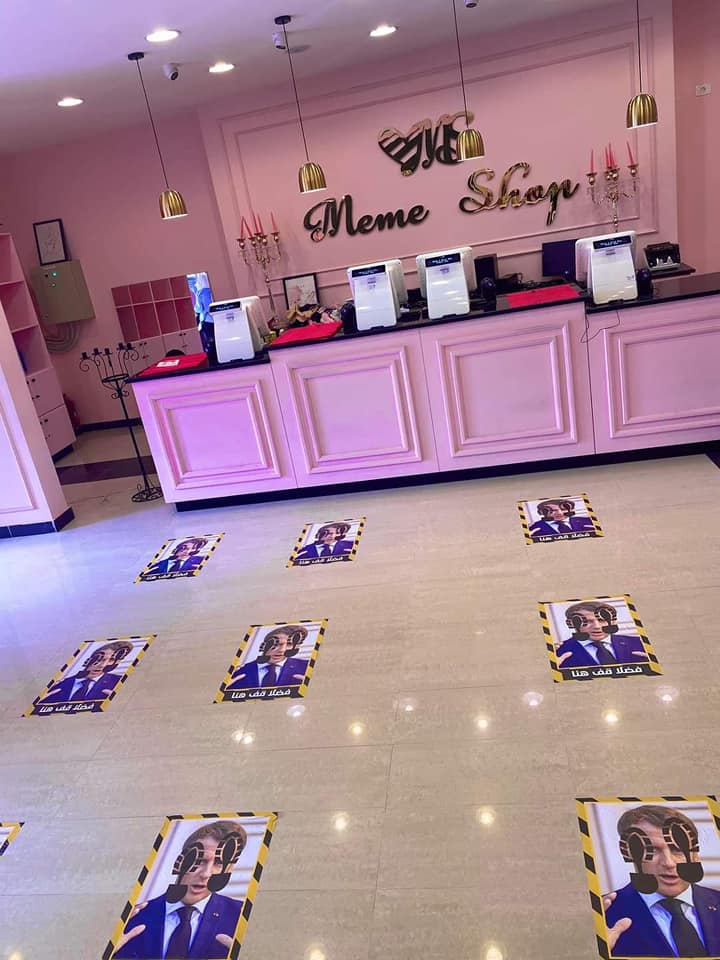 Lyobserver's tweet photo. A woman-only store in #Tripoli, #Libya uses social distancing floor stickers printed with the photo of French president Macron. #France https://t.co/KcUshpQ1oG