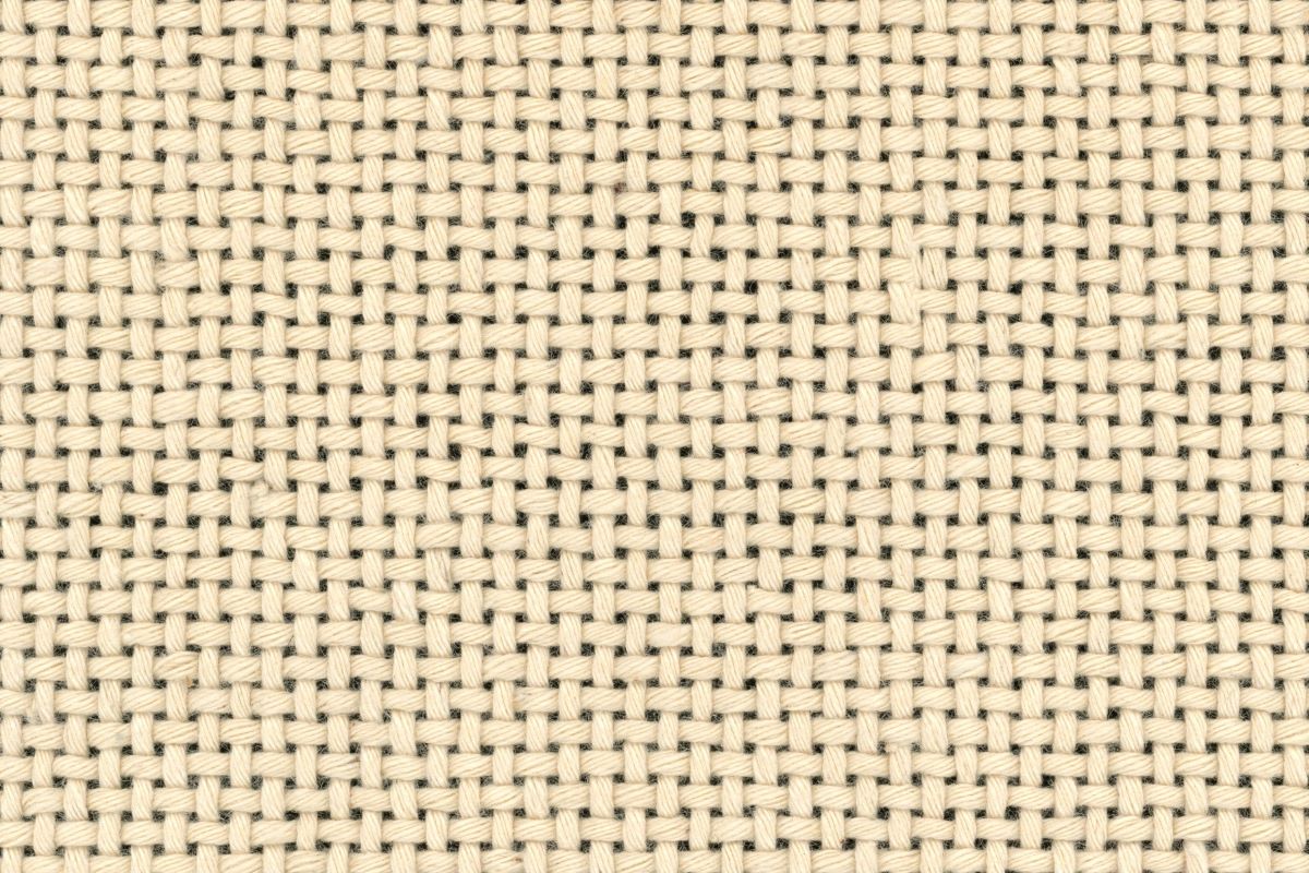 Beige fibers in balanced plain weave pattern on a dark background.