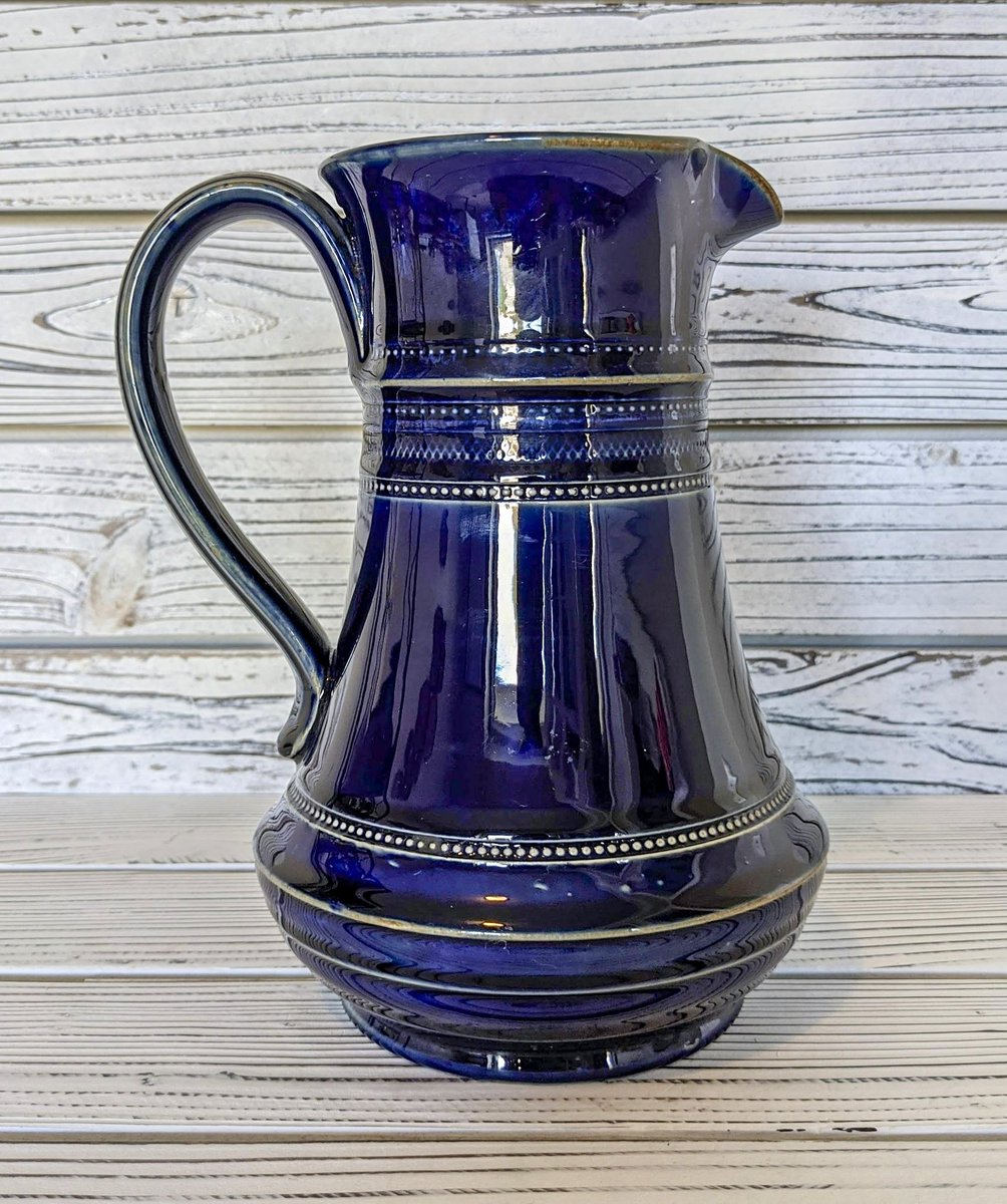 Incredible piece of antique Royal Doulton pottery! Cobalt blue w/ beige detailing. Early 1900s, 8'. Available now. Link in bio. [$85] #VintageBeauties #shopvintage #antique #royaldoulton #antiquepottery #blue #cobaltblue #pitcher #ceramics #antiqueceramics #vintageceramics