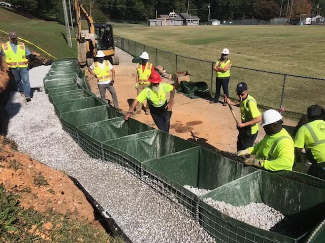 CHAPublicWorks's tweet photo. #CHAPublicWorks are working on slope repairs at the Hixson Youth Athletic Association using a new product. The vendor donated the materials &amp; provided training to our crews. https://t.co/ftbs47yZeo