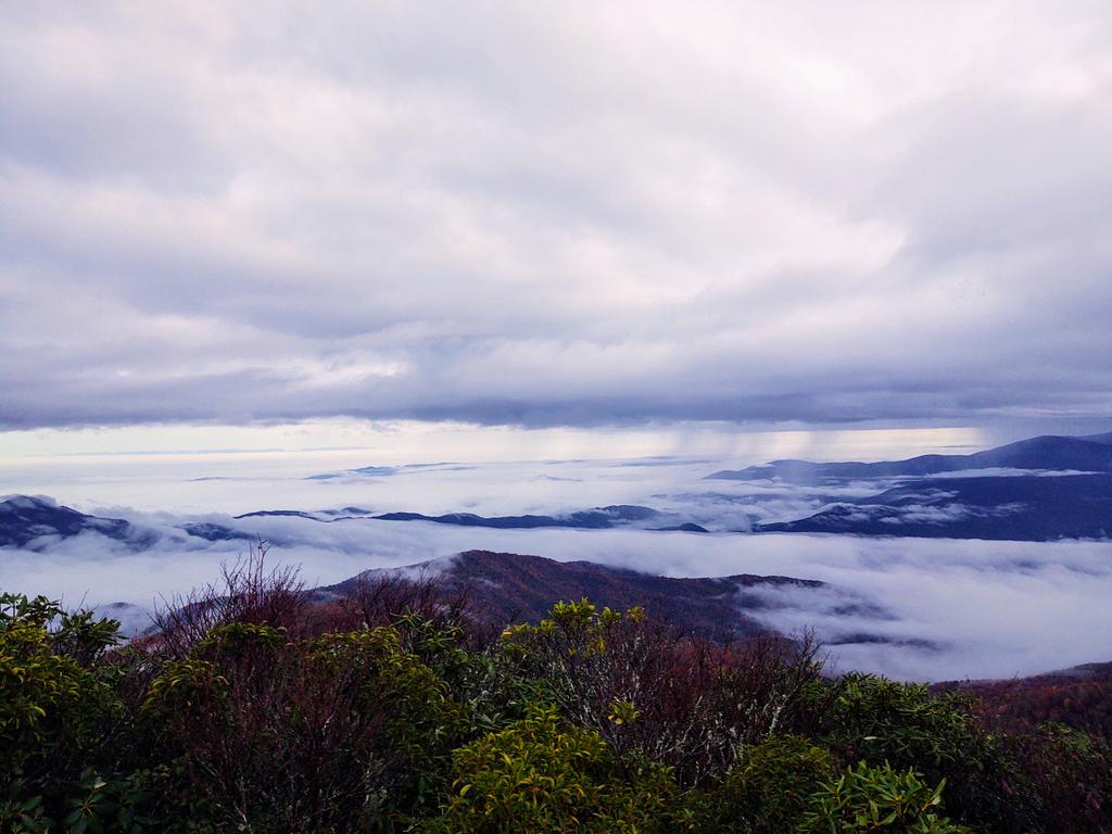 SouthHighlander's tweet photo. Pillow clouds rise to meet us at 5,100 FT. It's October and that can only mean one thing, Hangover. It's a 34 year Southern Highlander tradition. Near record crew on the rock this year. #slickrock #backpacking #cheoah #NNF https://t.co/9clRKV471E