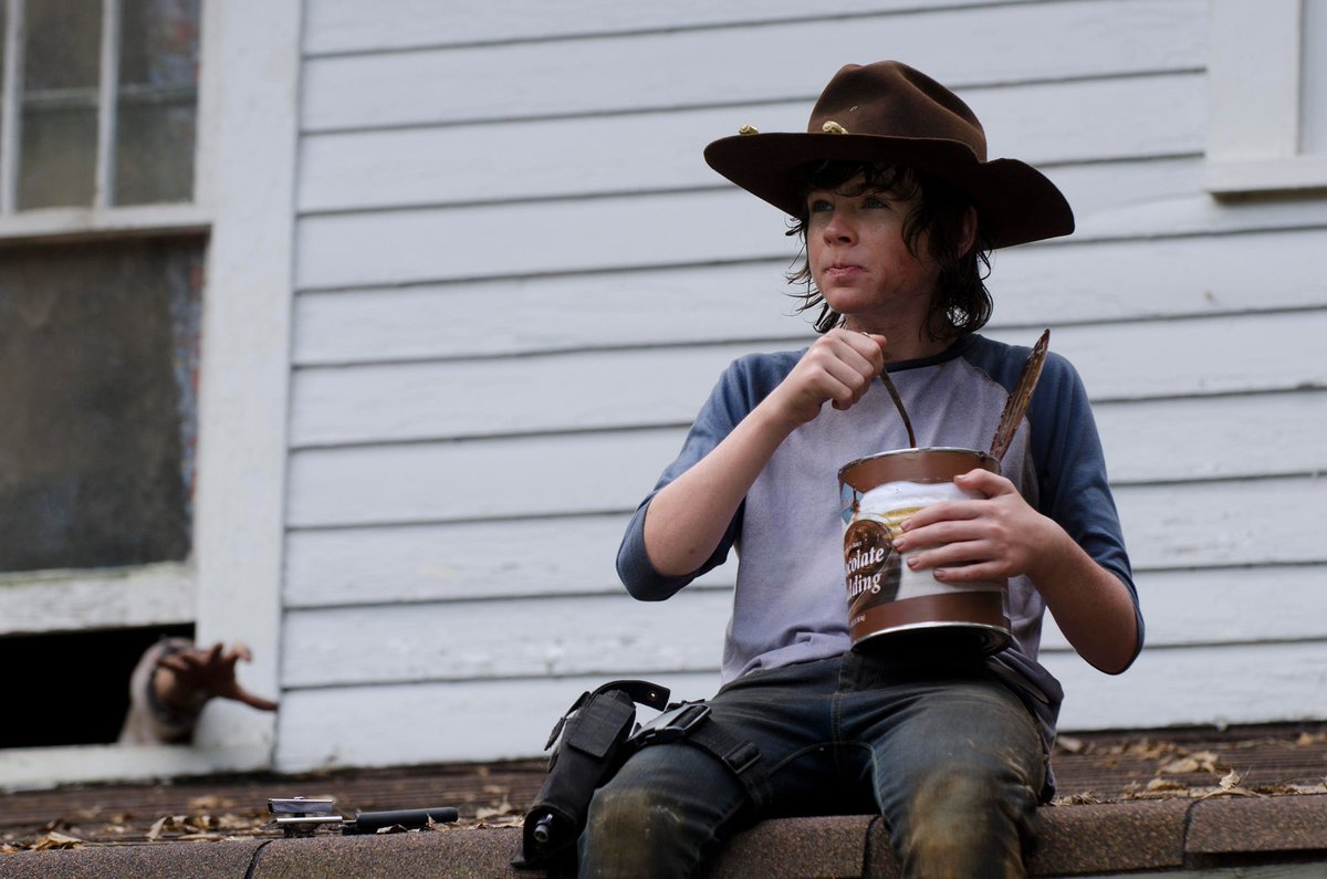 Chandler Riggs as Carl GrimesThe child soldier. The kid. Robbed of his youth, but determined to make sure the next generation thrives. Flirted with darkness, but filled with light. A son & a brother. Forced to carry the weight of the world on his shouldersThis is Carl Grimes.