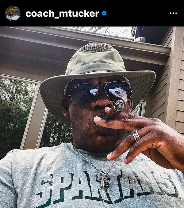 Mel Tucker smoking a cigar