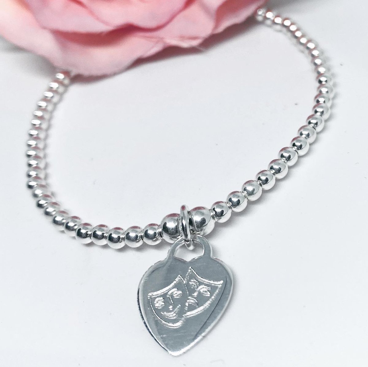 nerysgjewellery's tweet photo. 🌸Custom order🌸 Engraved sterling silver heart charm on 3mm beads with #Drama #theatre 🎭 masks on one side and name on the other
#sterlingsilverjewelry #sterlingsilverjewellery #silver #bracelets #theatre #dramamasks #jewellery #charmbracelet #stackingbracelets #jewellery https://t.co/R2RNs07iqi