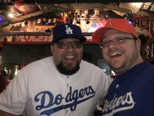 ChrisLanuti's tweet photo. My buddy Matt and me.
Game 7 in 2017.
I was on my way to Australia for two weeks &amp; luckily had a night in LA the night of that game.

He met me at the airport with a @Dodgers shirt and took me to El Segundo.

We didn't know the Astros were cheating then.
I'm so happy for him now. https://t.co/WsVx54xoJj