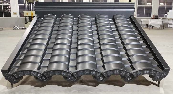 A traditional Chinese roof tile made from dark grey ANTHRA-ZINC shows the flexibility of #vmzinc
