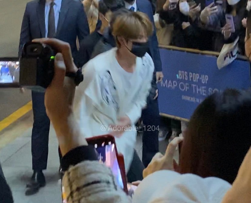 Jin is wearing the Black Swan Cardigan 