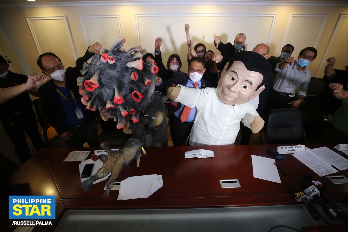 A mascot of President Rodrigo Duterte punches another mascot representing the new coronavirus during a press conference of a joint movement pushing for free COVID-19 vaccination on Wednesday. https://t.co/Iu197K0UkK