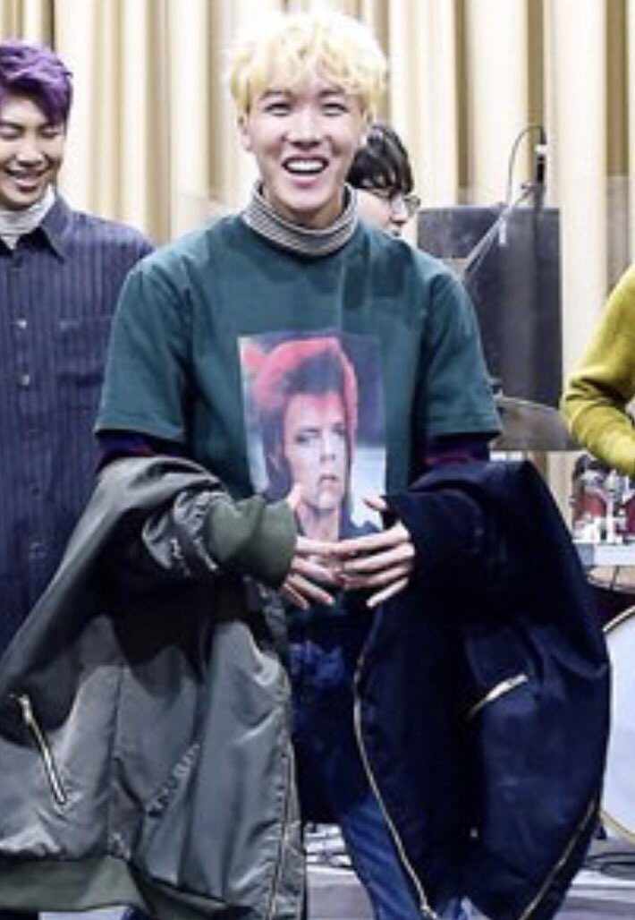 Hoseok also owns several David Bowie tees. David is a 1970s Rock/alternative music icon known for innovative work, visual representation, and androgynous style.