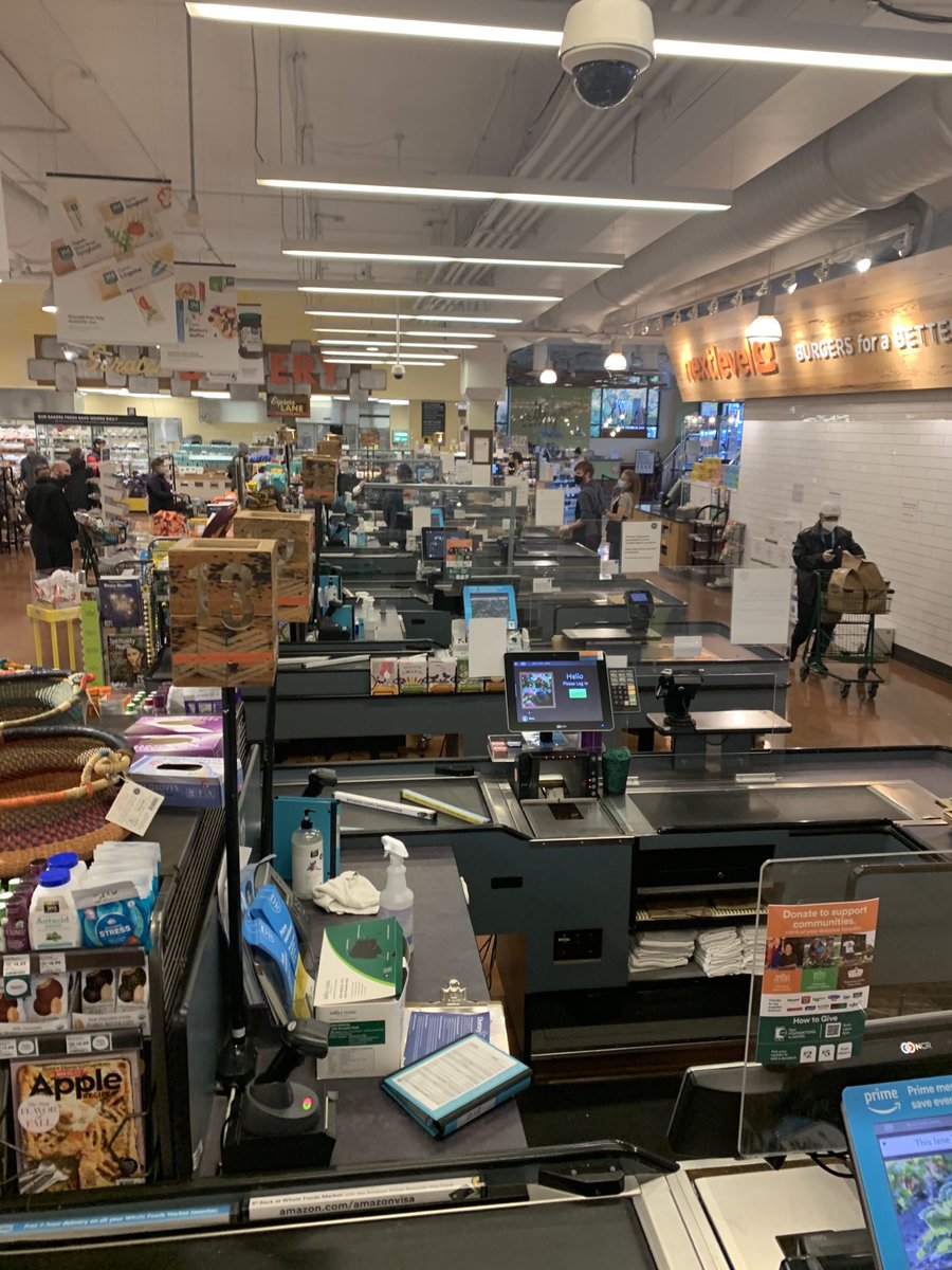 ebenson's tweet photo. So sad that ⁦@amazon⁩ is destroying ⁦@WholeFoods⁩  with their cost cutting ways - lunch time in north seattle Roosevelt Square has two checkout lines. https://t.co/RvUtx9c581