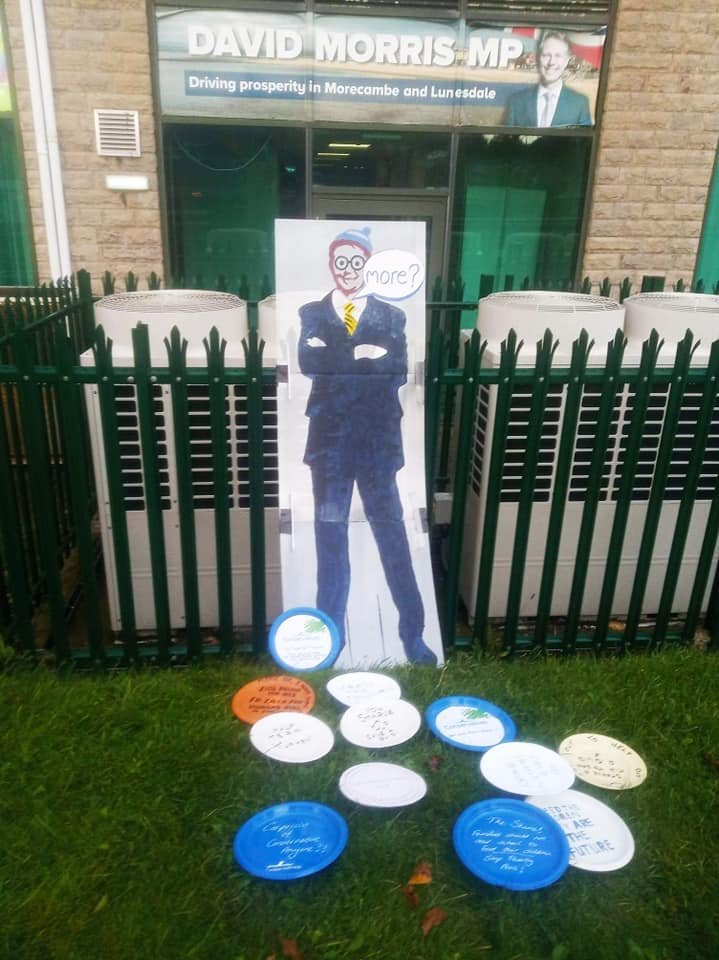 before_profit's tweet photo. Feed Hungry Kids! #EmptyPlateProtest outside the office of David Morris Conservative MP for Morecambe & Lunesdale. He voted against extending free school meals. 100s of families in Morecambe rely on food banks. In 2019-20 he claimed over £77,600 in expenses. #PeopleBeforeProfit https://t.co/dqrXLAyb7O