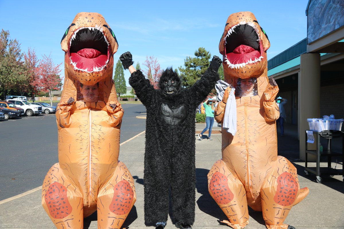 Everybody Gets A Book Wednesday--Even the Dinosaur! Frontier Middle School is hosting their first ever 'Everyone Gets A Book Wednesday" event. Staff is passing out books to students. Oh, yeah a student showed up in a dinosaur costume &amp; hung out with the Silverback for awhile.